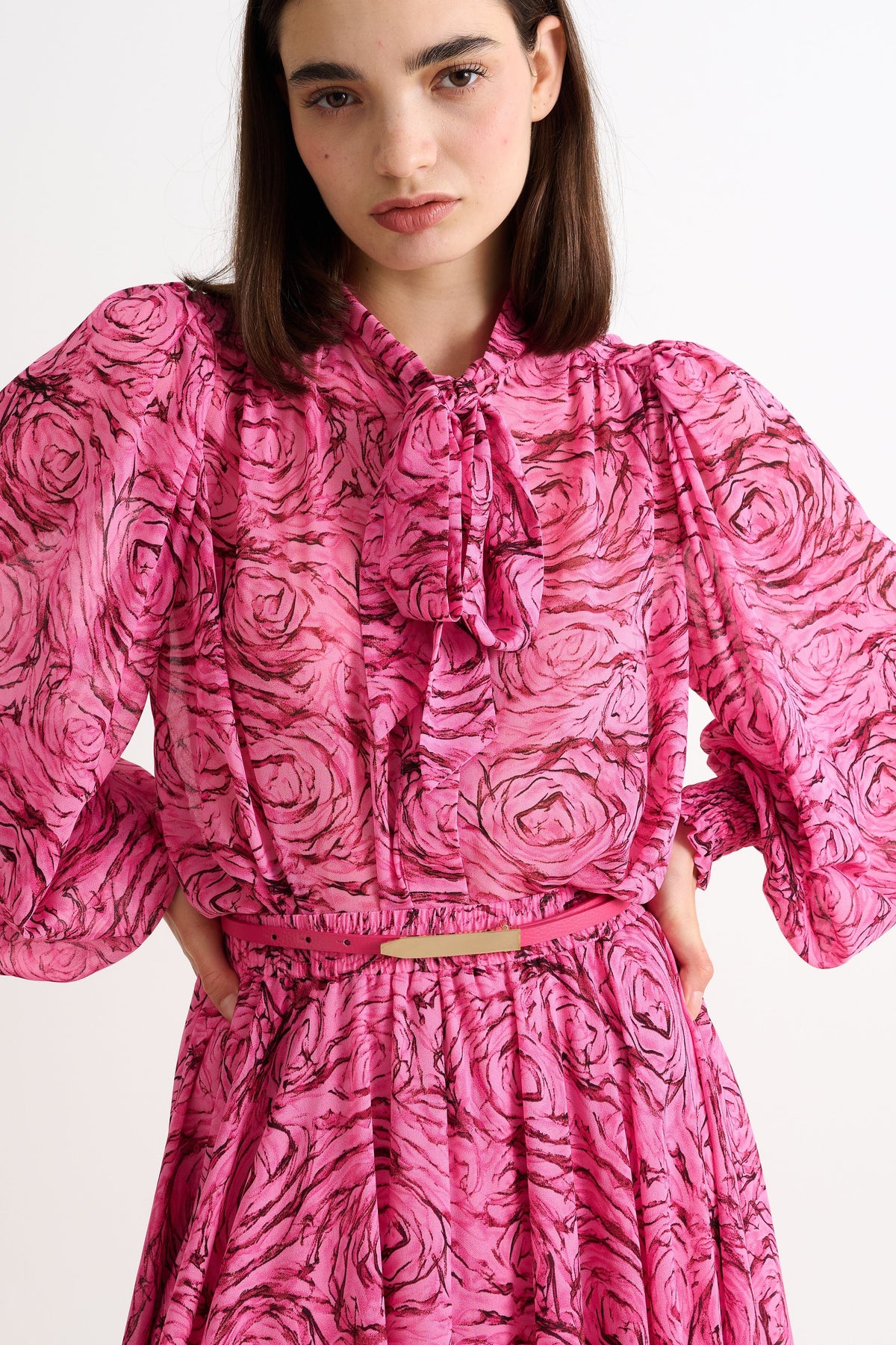 woman wearing The Louche Amira Sleek Belt in Pink