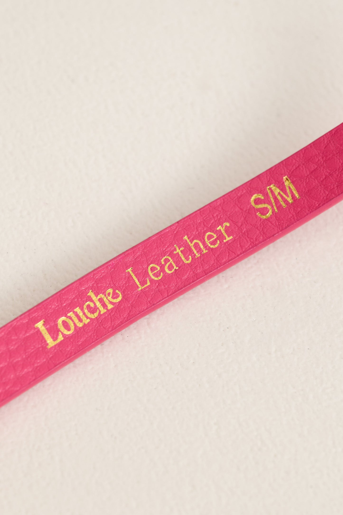close up The Louche Amira Sleek Belt in Pink